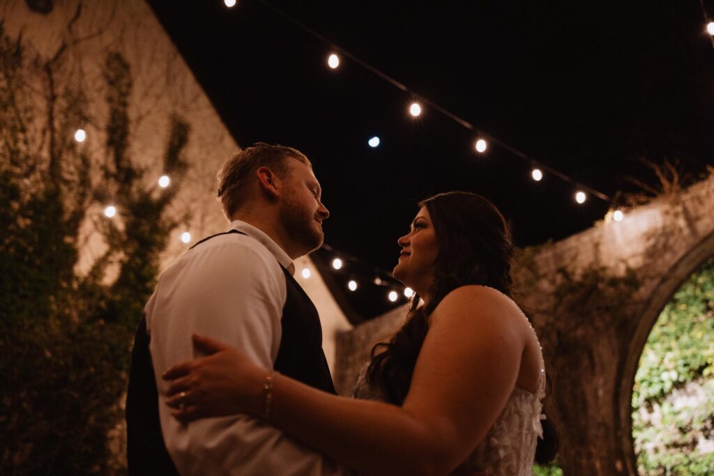 Newlyweds dancing under the stars.