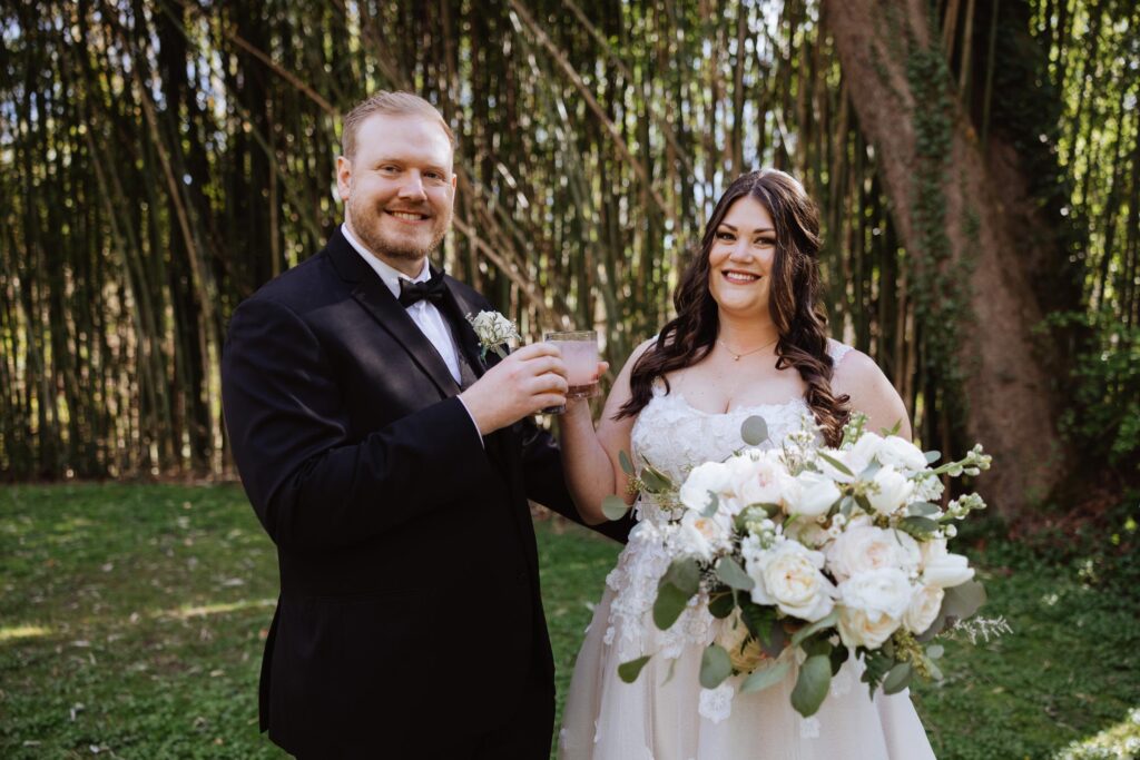 Newlyweds "cheering" during cocktail hour.