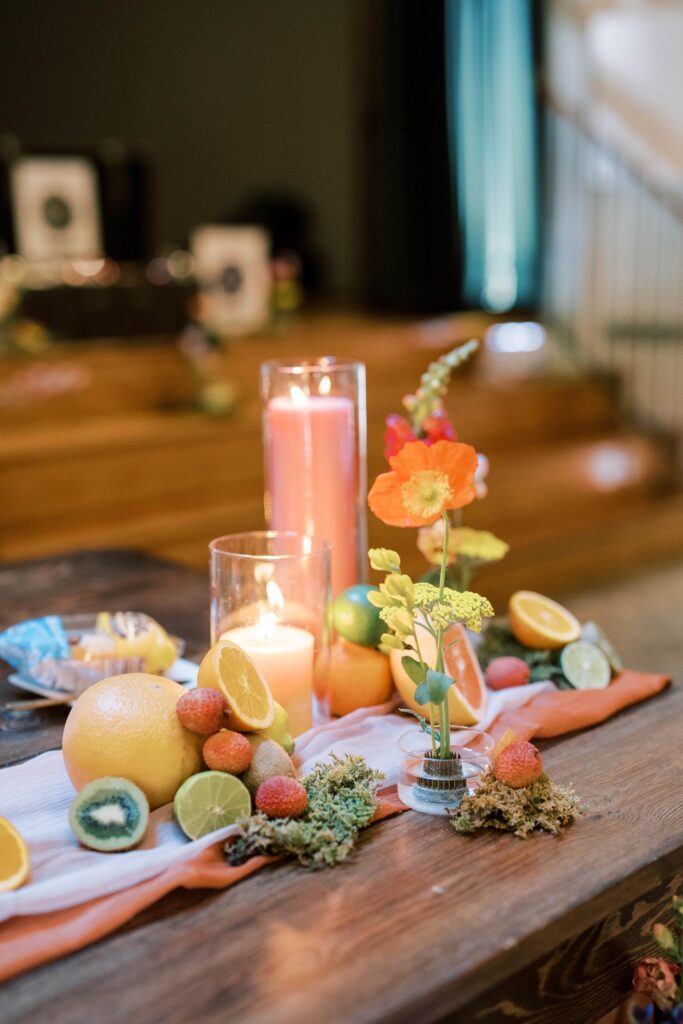 Citrus centerpeice with a candle, grapefruits, kiwis, oranges etc.