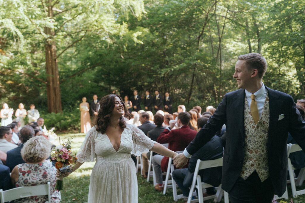 Newlyweds walking up the aisle.