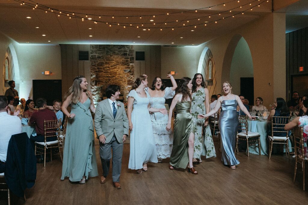 Bride and bridesmaids dancing on the dance floor.