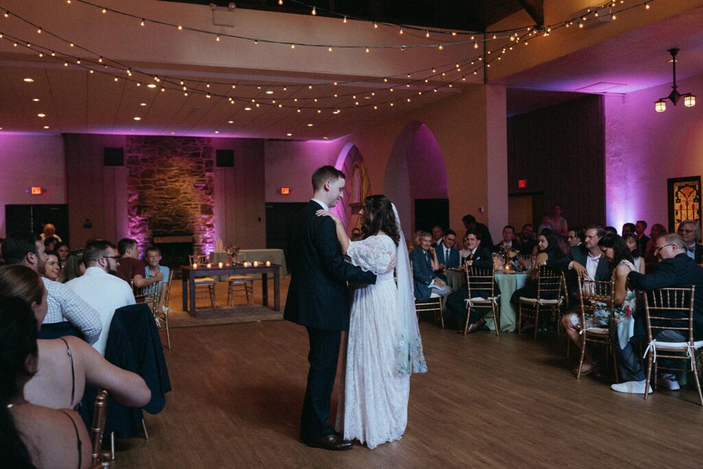 Newlyweds dancing to their first dance at the reception.